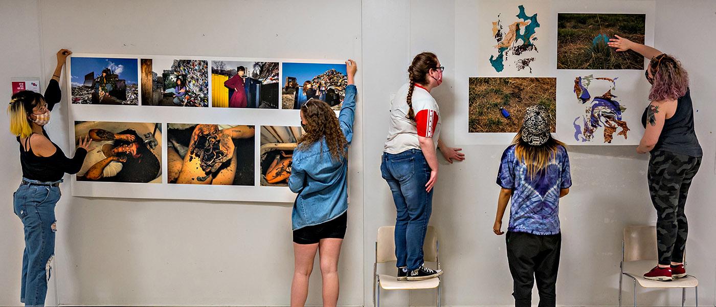 Students hanging images